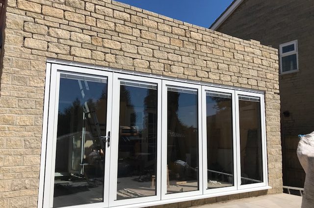 swing and slide door with white frame